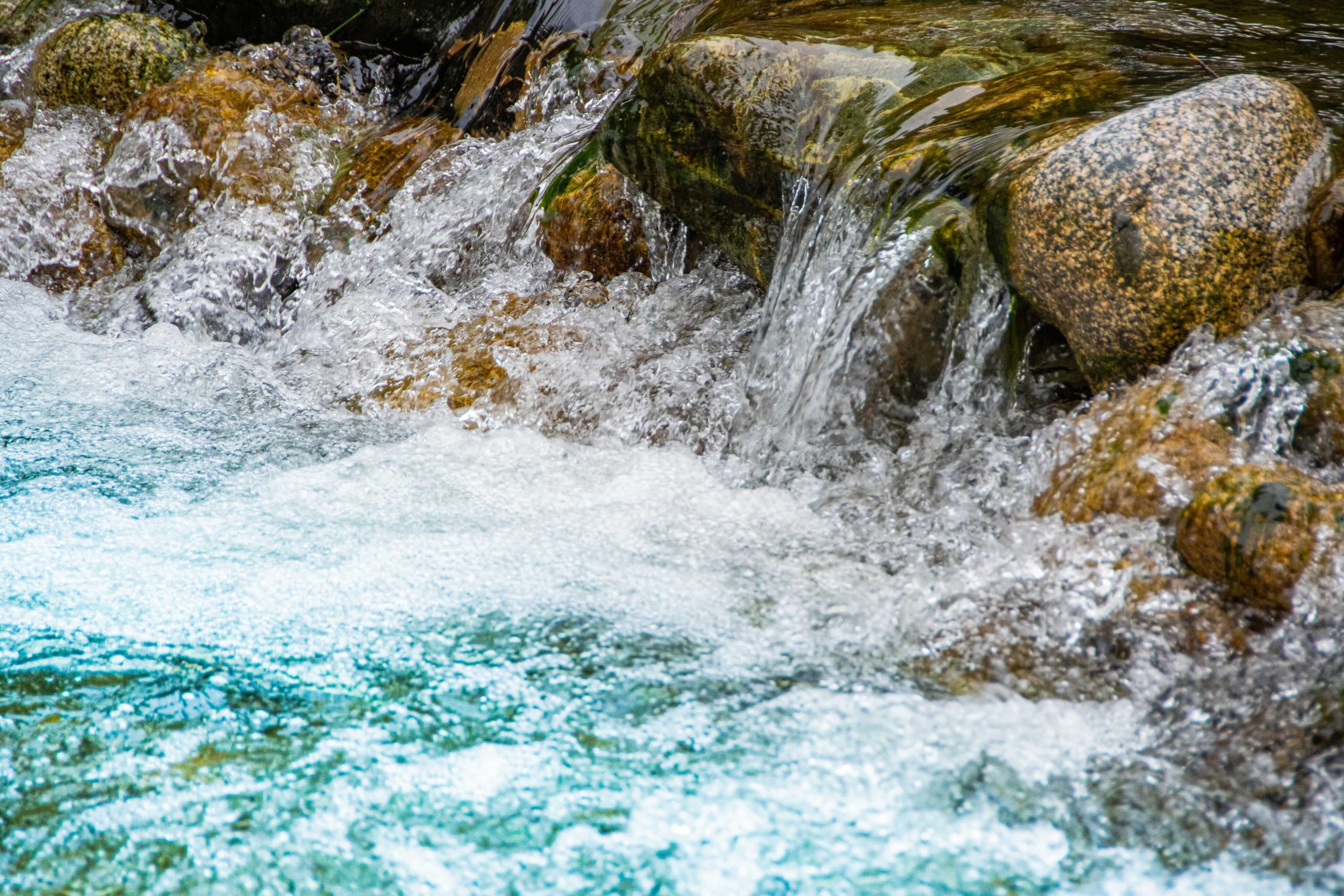 fast flowing river. Mountain stream among rocks. Water tourist trip